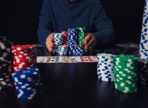 stashes of poker chips on a black table